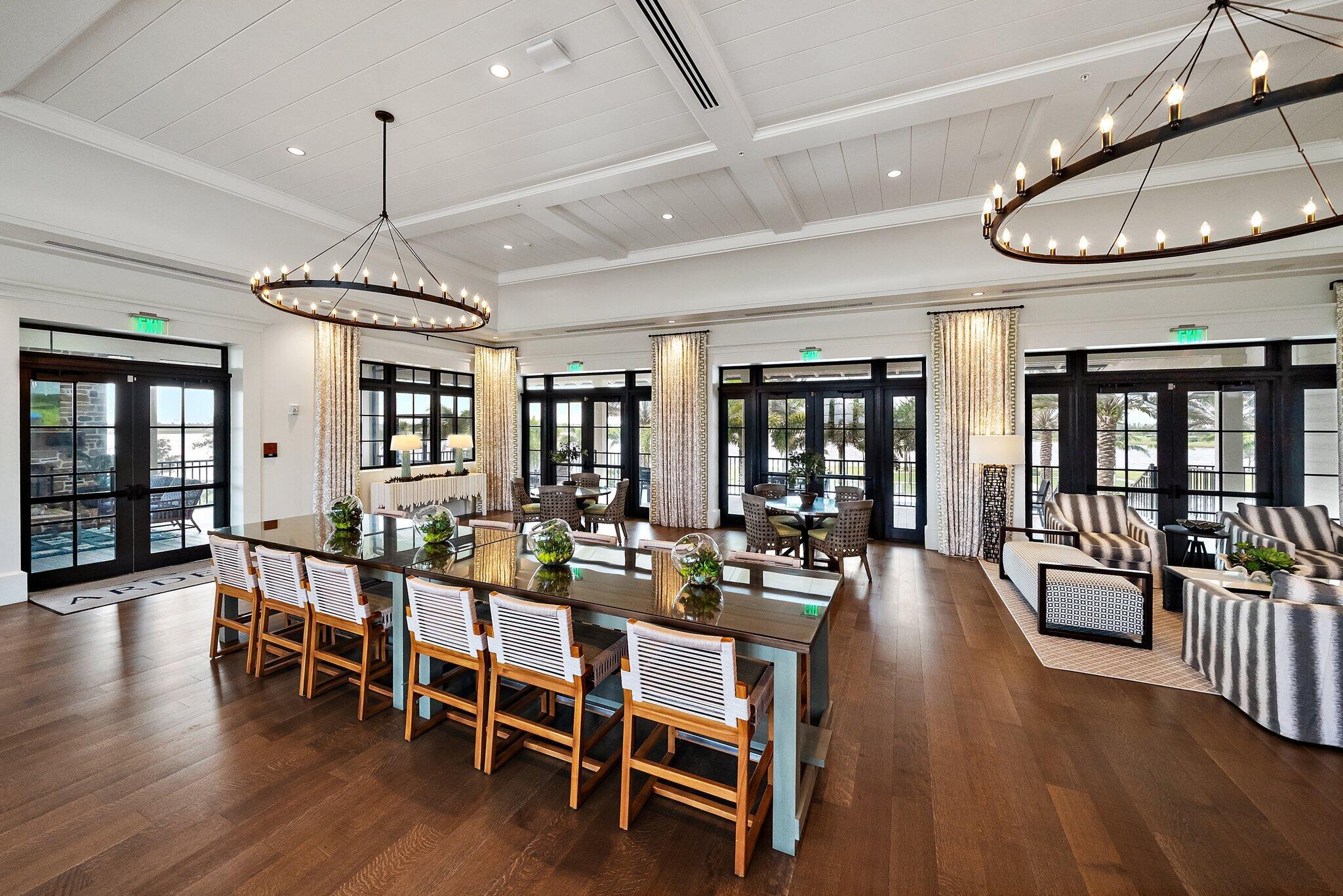 19540 Wheelbarrow Bend Loxahatchee, FL 33470 - Photo 43 of 54 a view of a dining room with furniture wooden floor and chandelier