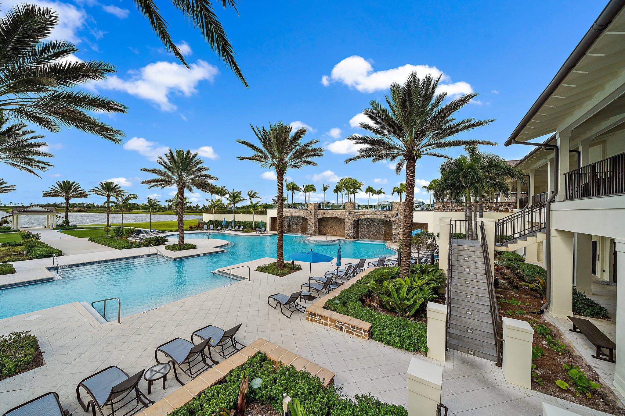 19540 Wheelbarrow Bend Loxahatchee, FL 33470 - Photo 46 of 54 a view of a swimming pool with a table and chairs