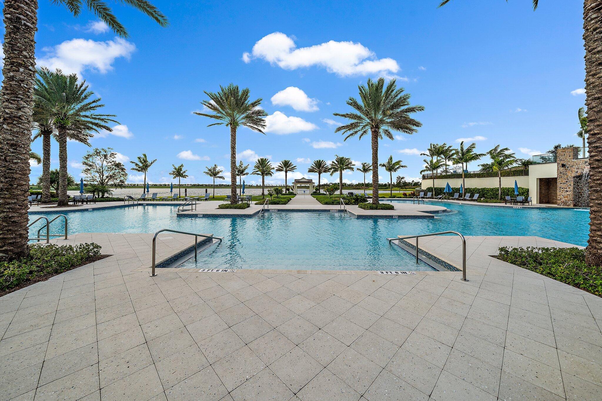 19540 Wheelbarrow Bend Loxahatchee, FL 33470 - Photo 47 of 54 a view of a lake with chairs