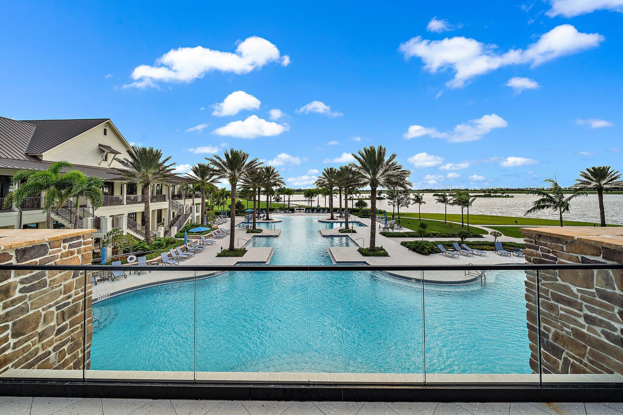 19540 Wheelbarrow Bend Loxahatchee, FL 33470 - Photo 52 of 54 a view of a swimming pool with an outdoor seating