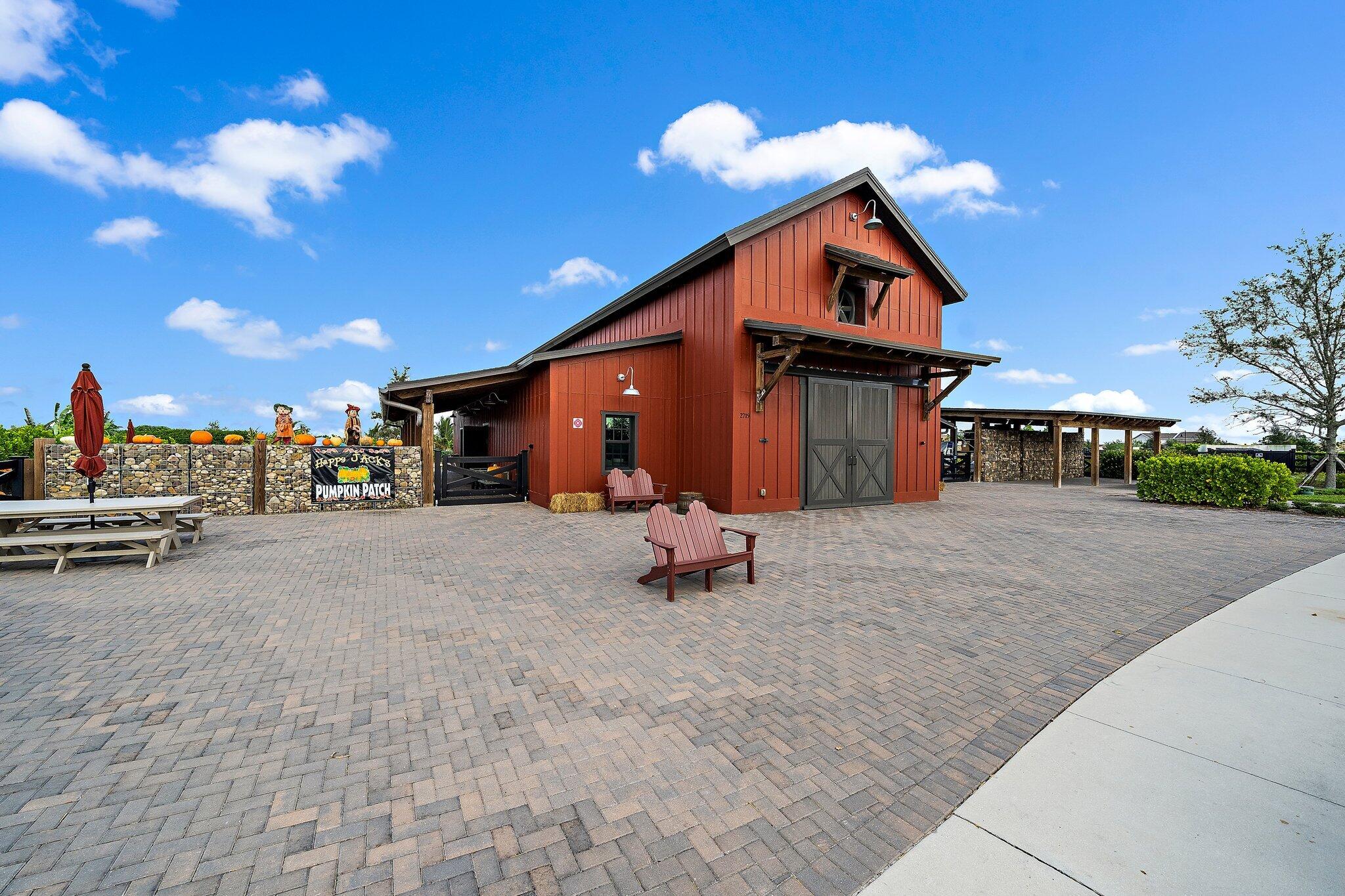 19540 Wheelbarrow Bend Loxahatchee, FL 33470 - Photo 54 of 54 a swimming pool with outdoor seating and yard in the back