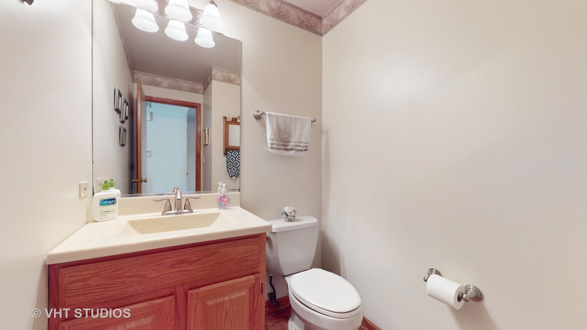 103 Crystal Lake Road Lake In The Hills, IL 60156 - Photo 17 of 42 a bathroom with a sink vanity mirror and toilet