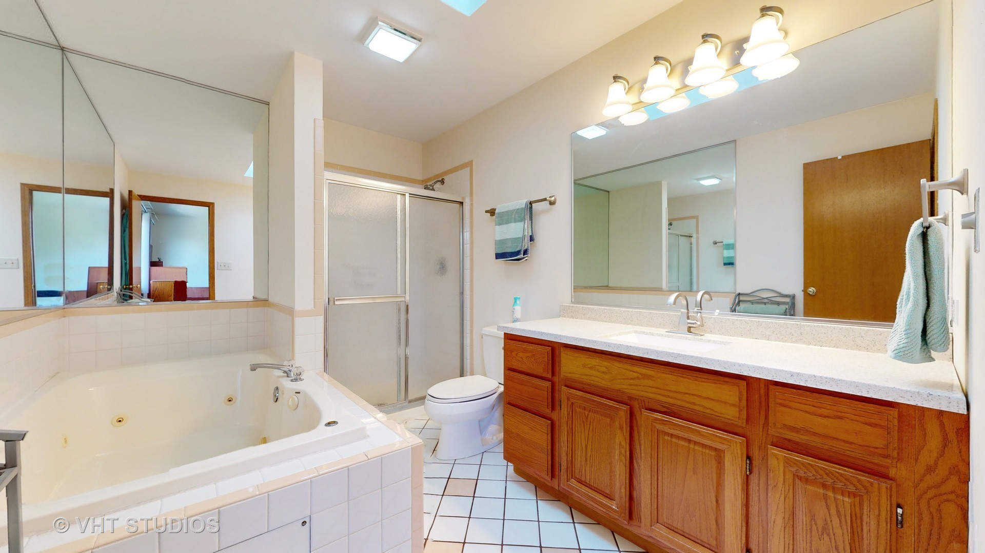 103 Crystal Lake Road Lake In The Hills, IL 60156 - Photo 21 of 42 a spacious bathroom with a tub sink shower and mirror