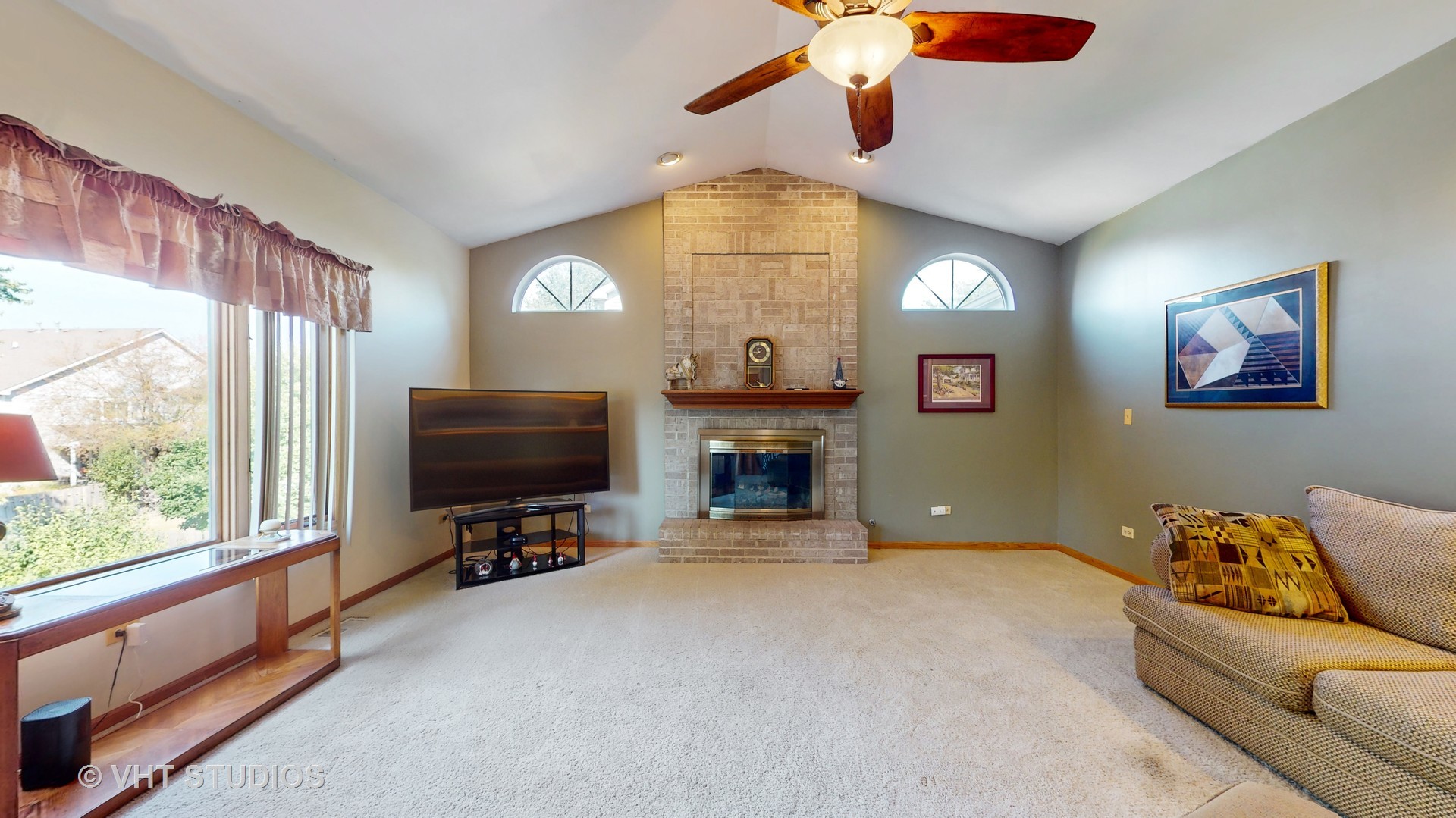 103 Crystal Lake Road Lake In The Hills, IL 60156 - Photo 6 of 42 a view of a livingroom with furniture and a flat screen tv