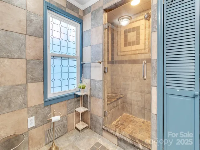 a kitchen with stainless steel appliances granite countertop white cabinets a sink and dishwasher