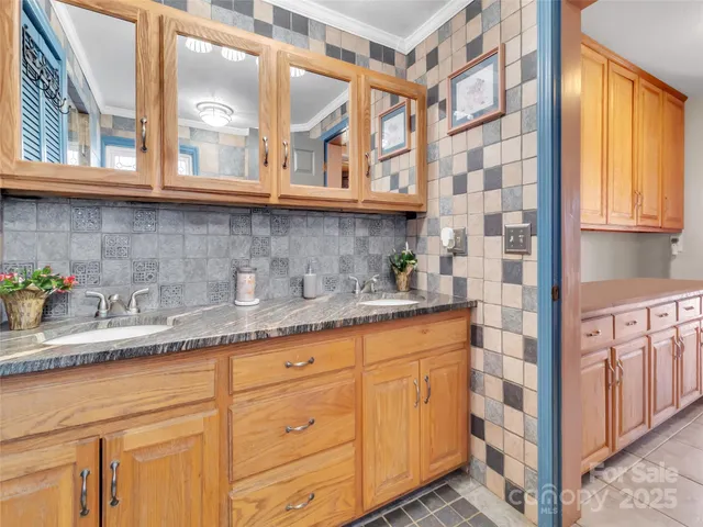 a view of a hallway with furniture and a potted plant