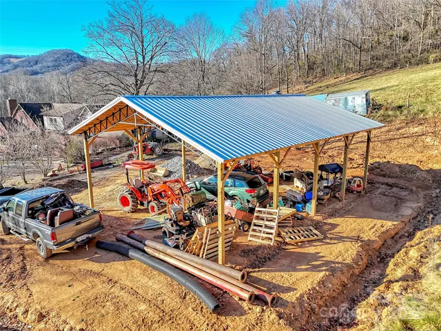 a car parked in front of a house with a yard
