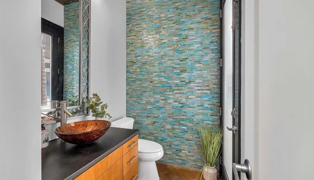 a kitchen with stainless steel appliances granite countertop a sink stove and microwave