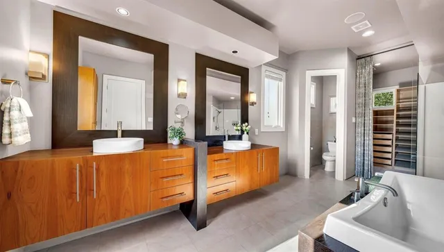 a bedroom with bed and glass windows