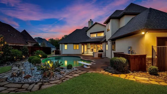 an aerial view of a house with outdoor space