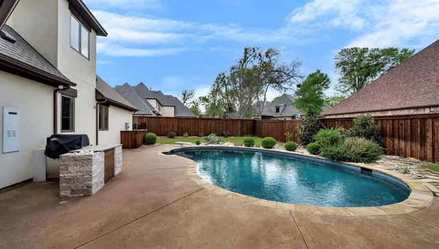 an aerial view of a house roof deck and patio