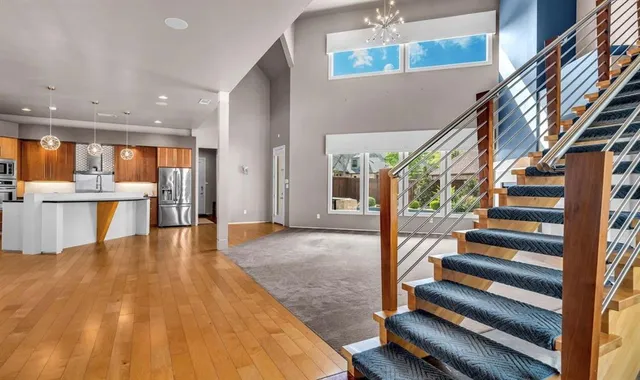 a view of entryway and hall with wooden floor