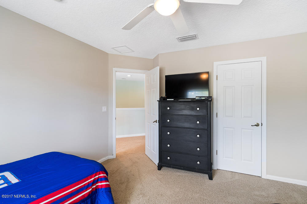 3151 East Banister Road St. Augustine, FL 32092 - Photo 29 of 34 Ceiling Fan and Carpet Floor
