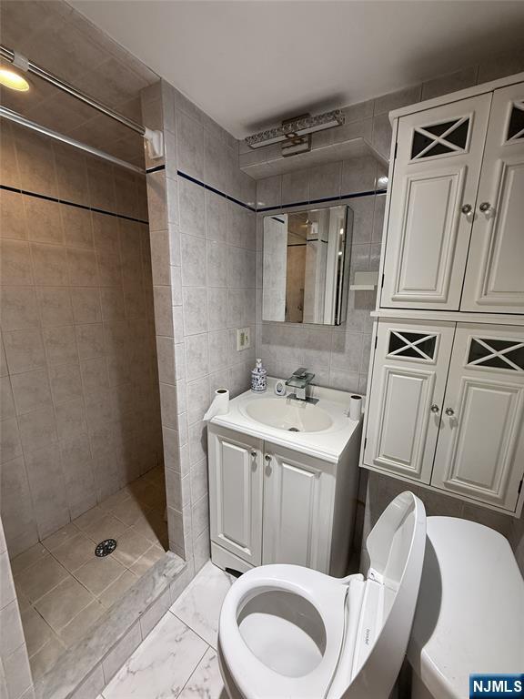 2 Millo Place, Unit 1 Little Ferry, NJ 07643 - Photo 5 of 8 a bathroom with a sink toilet and shower