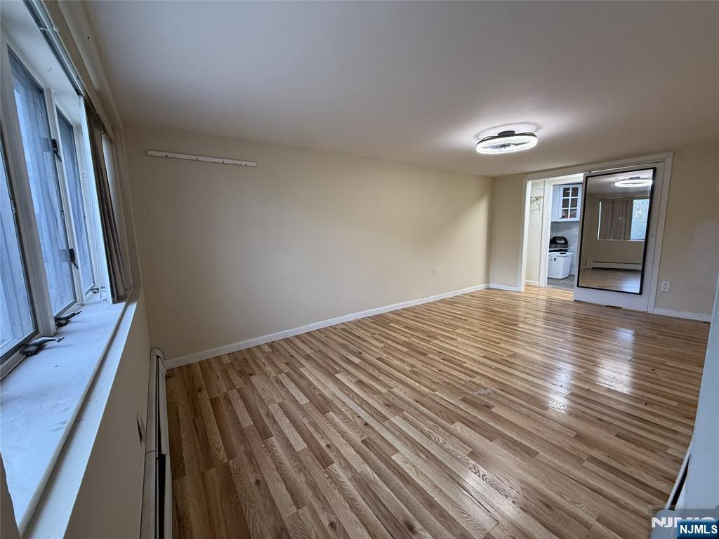 2 Millo Place, Unit 1 Little Ferry, NJ 07643 - Photo 6 of 8 a view of a room with wooden floor and staircase