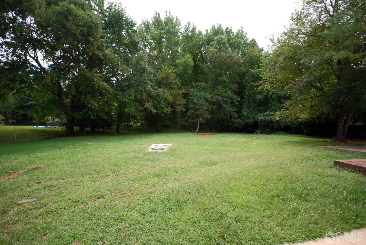 82 Red Valley Road Millstone Township, NJ 08510 - Photo 5 of 26 a view of outdoor space with deck and yard