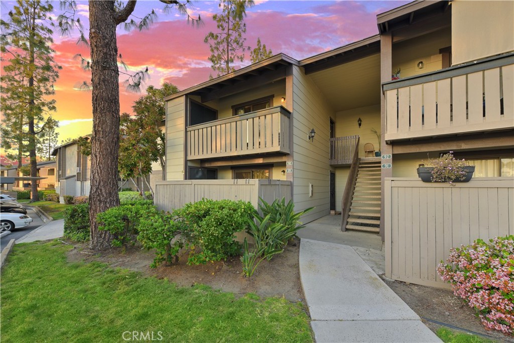20702 El Toro Road, Unit 90 Lake Forest, CA 92630 - Photo 1 of 1 a front view of a house with garden