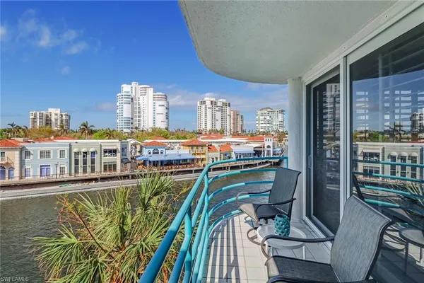a view of a balcony with chairs