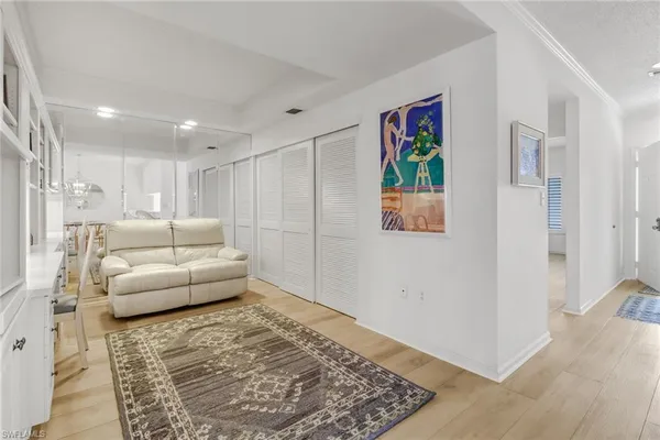 a living room with furniture and a rug