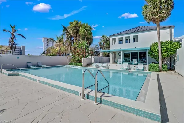 a view of a swimming pool with a patio