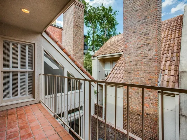 a view of balcony with wooden floor and fence and stairs