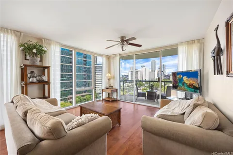 a living room with furniture and a flat screen tv
