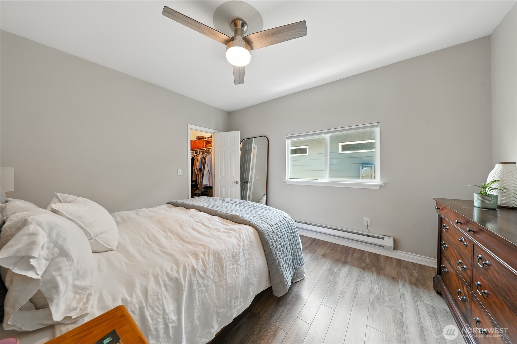 4616 South Orcas Street Seattle, WA 98118 - Photo 15 of 37 a bedroom with a bed and a dresser