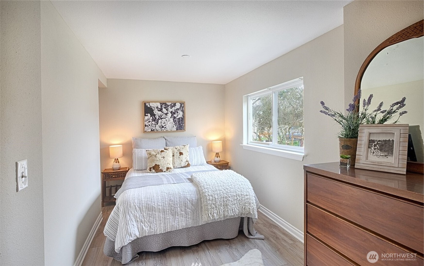 4616 South Orcas Street Seattle, WA 98118 - Photo 18 of 37 a bedroom with a large bed and a window