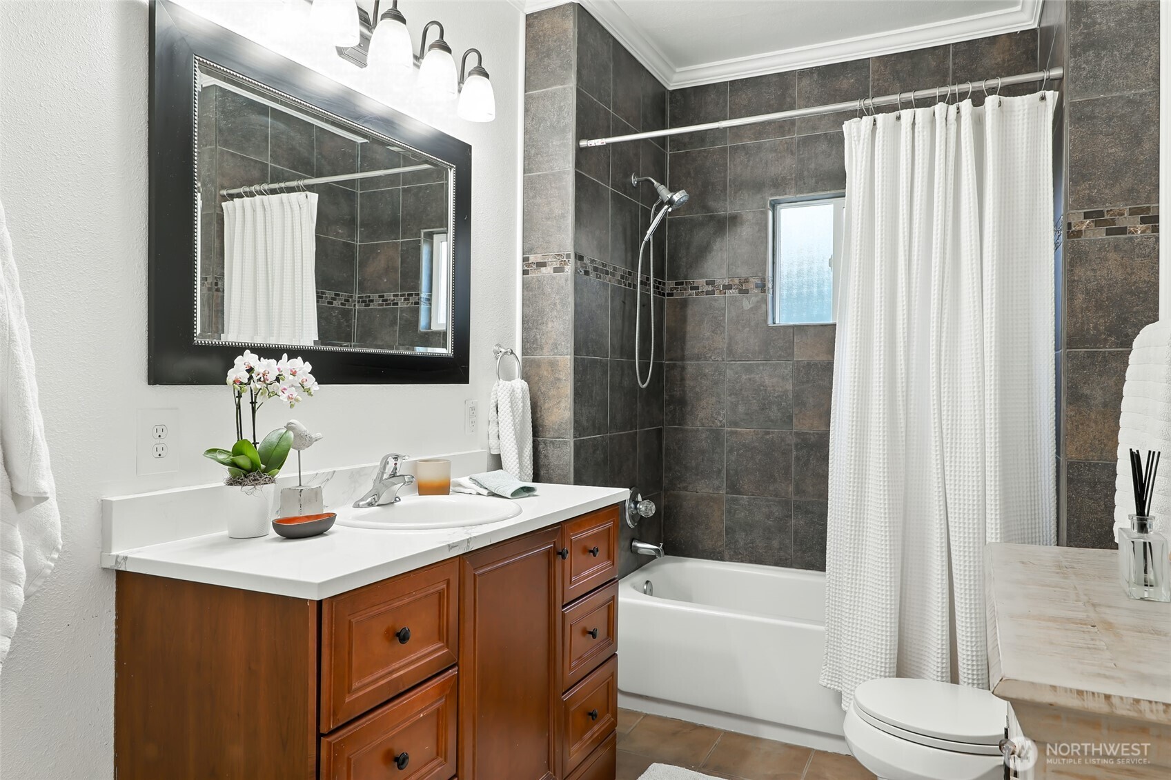 4616 South Orcas Street Seattle, WA 98118 - Photo 22 of 37 a bathroom with a sink mirror toilet and bathtub