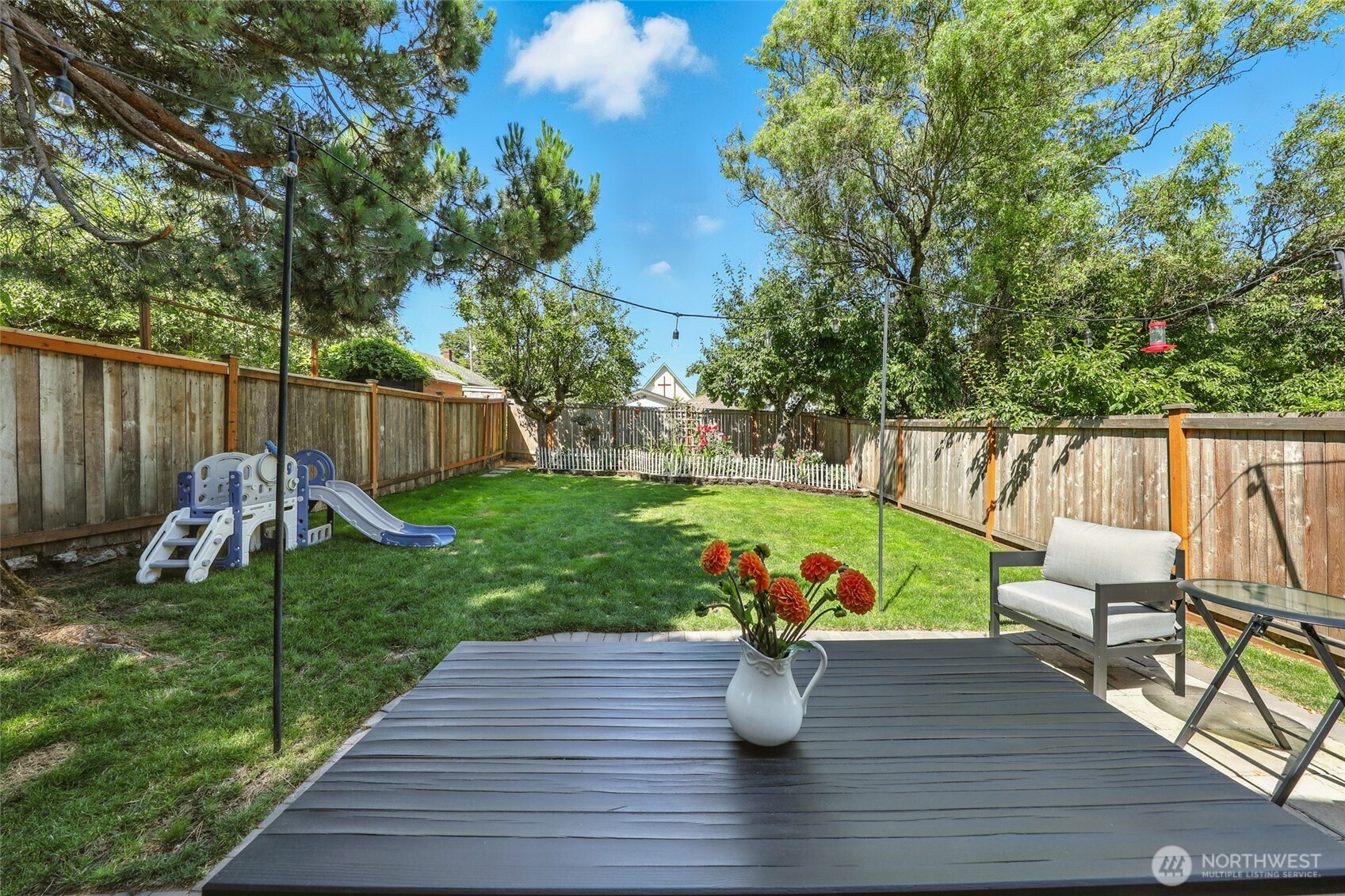 4616 South Orcas Street Seattle, WA 98118 - Photo 25 of 37 a view of a table and chairs on the deck