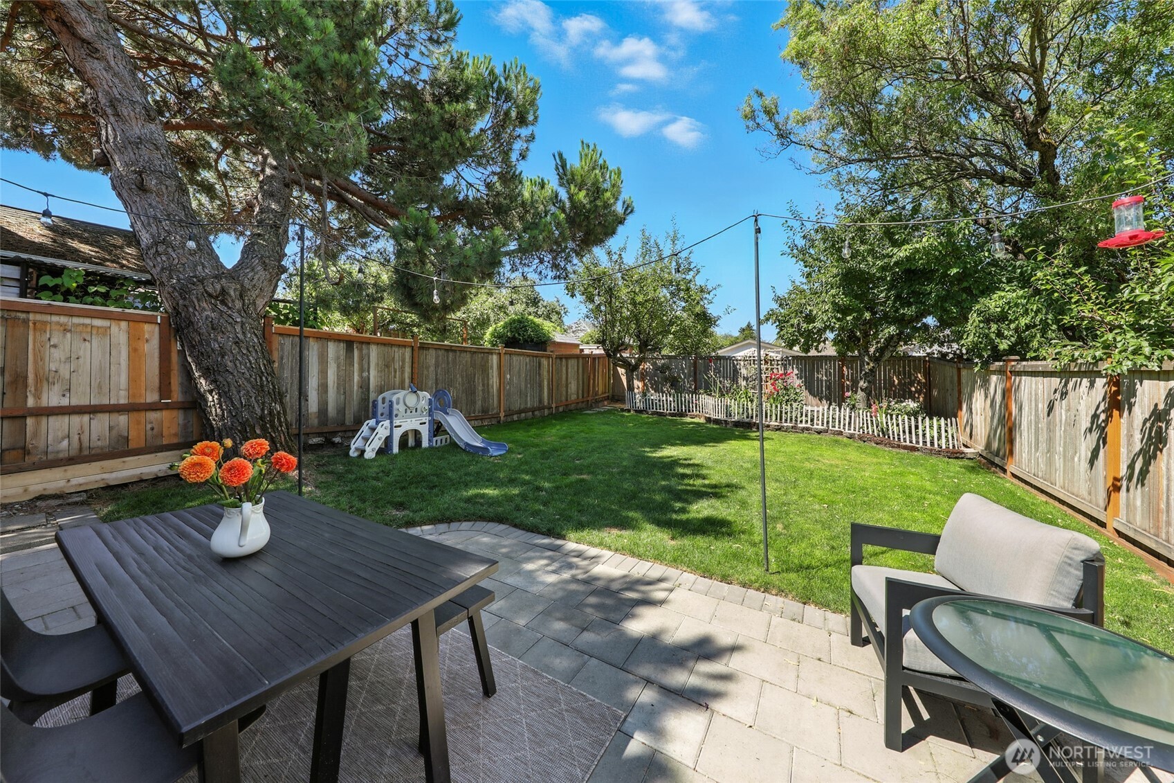4616 South Orcas Street Seattle, WA 98118 - Photo 26 of 37 a view of a backyard with sitting area and garden