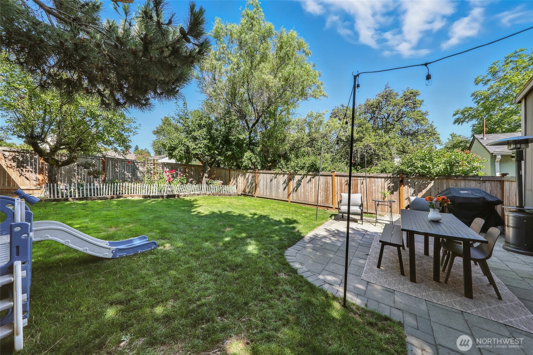 4616 South Orcas Street Seattle, WA 98118 - Photo 29 of 37 a view of a table and chairs in the garden