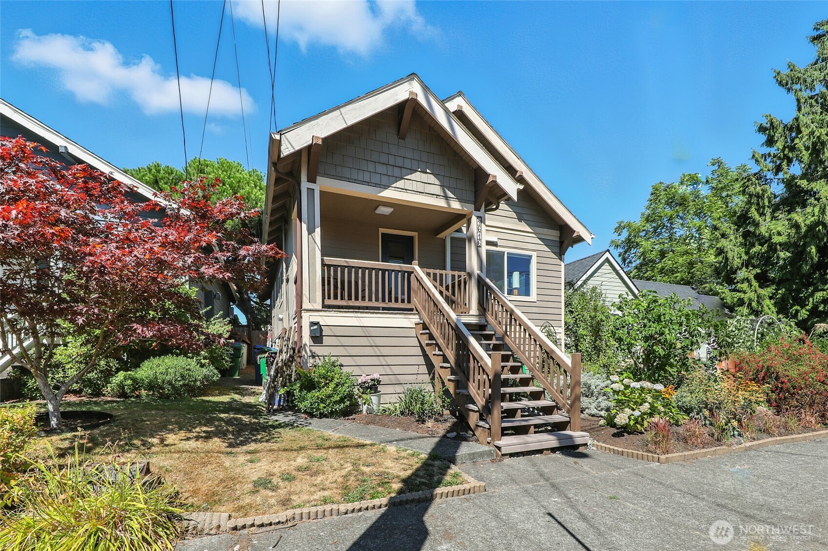 4616 South Orcas Street Seattle, WA 98118 - Photo 36 of 37 a front view of a house with garden