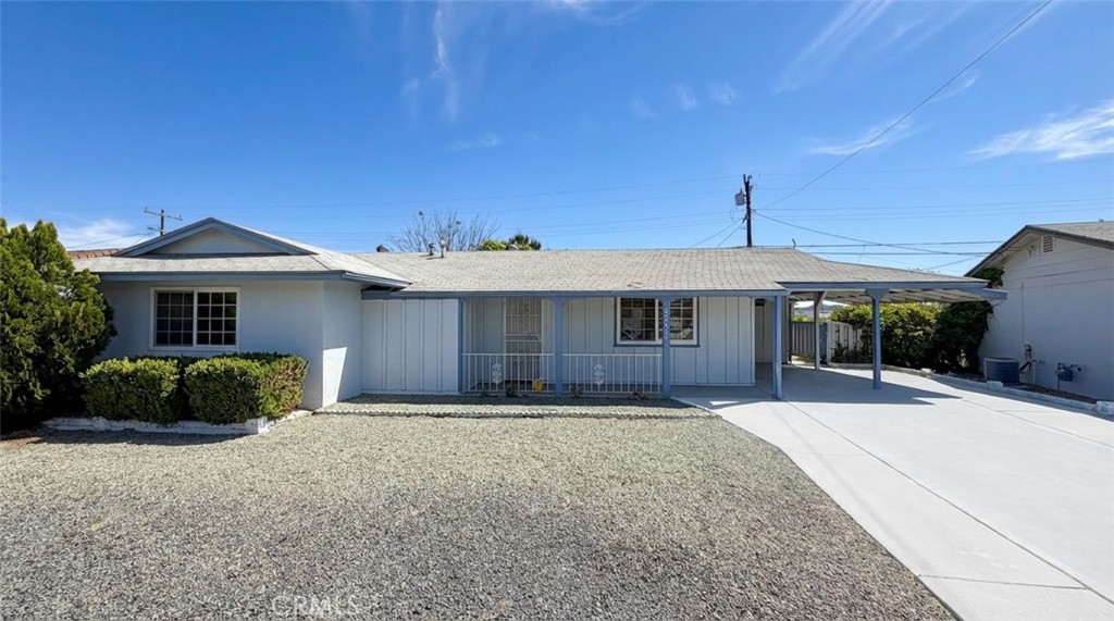 27077 El Rancho Drive Menifee, CA 92586 - Photo 2 of 11 a front view of a house with a yard and garage