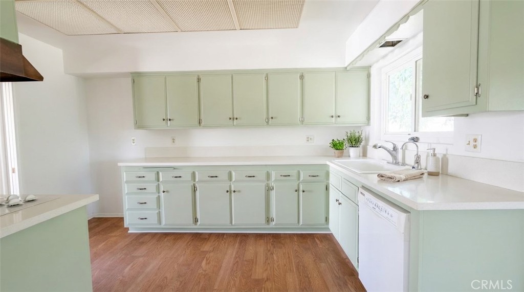 27077 El Rancho Drive Menifee, CA 92586 - Photo 3 of 11 a kitchen with a sink cabinets and a wooden floor