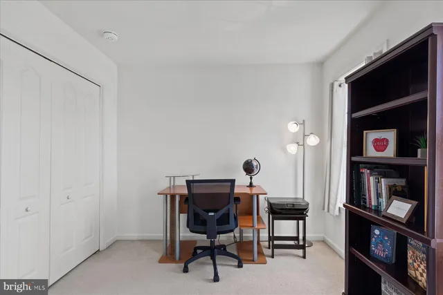 a bathroom with a sink vanity mirror and toilet