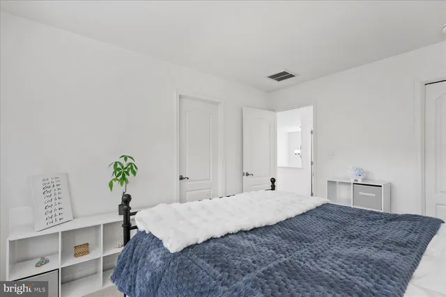 a view of a garden with a building in the background