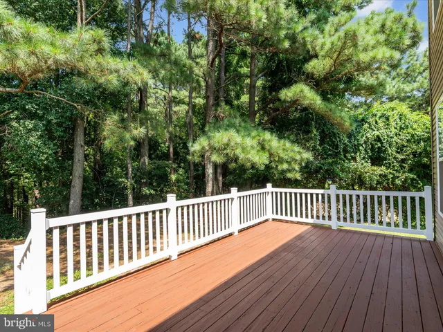 a view of deck and a yard