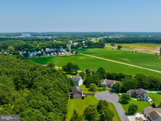 an aerial view of a city with lots of green space