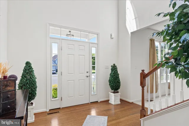a view of entryway with wooden floor