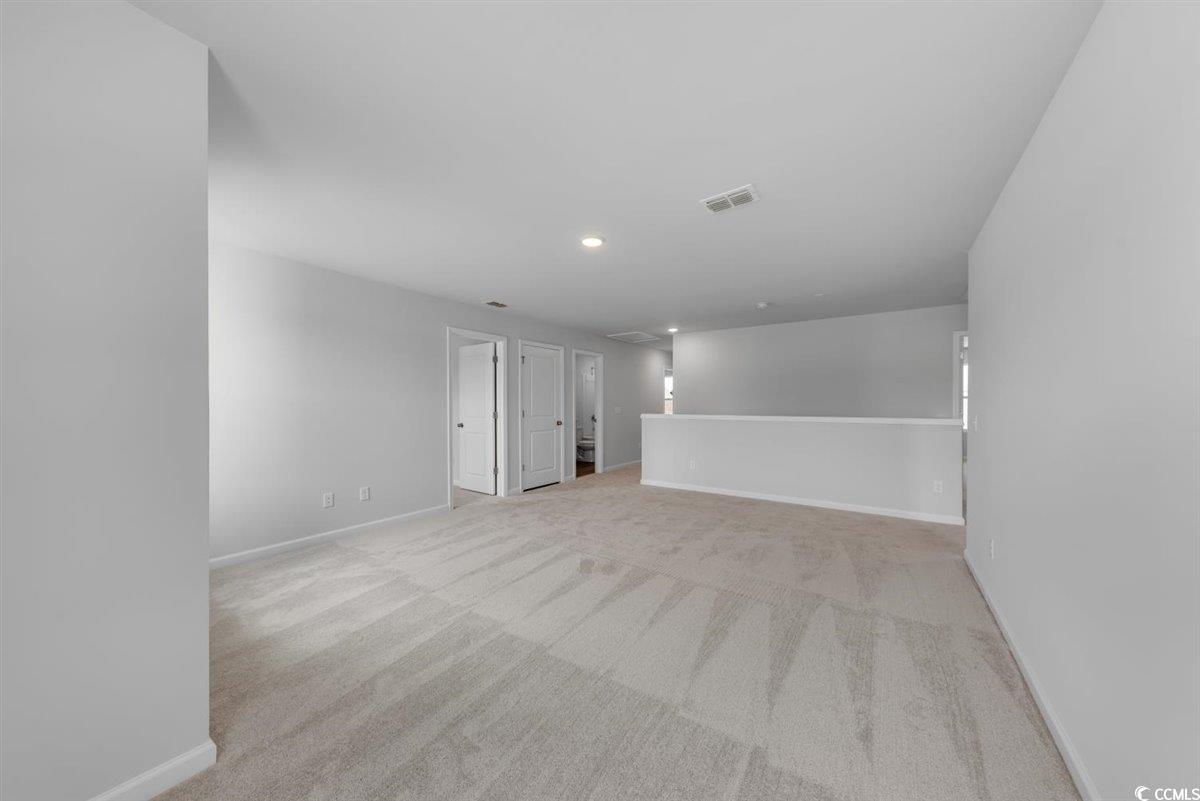 997 Laconic Drive Myrtle Beach, SC 29588 - Photo 12 of 22 Carpeted spare room featuring recessed lighting, b