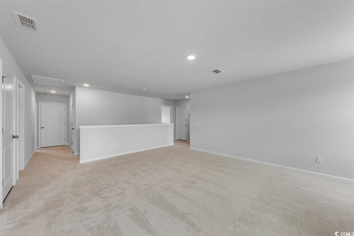 997 Laconic Drive Myrtle Beach, SC 29588 - Photo 13 of 22 Empty room with recessed lighting, light carpet, b