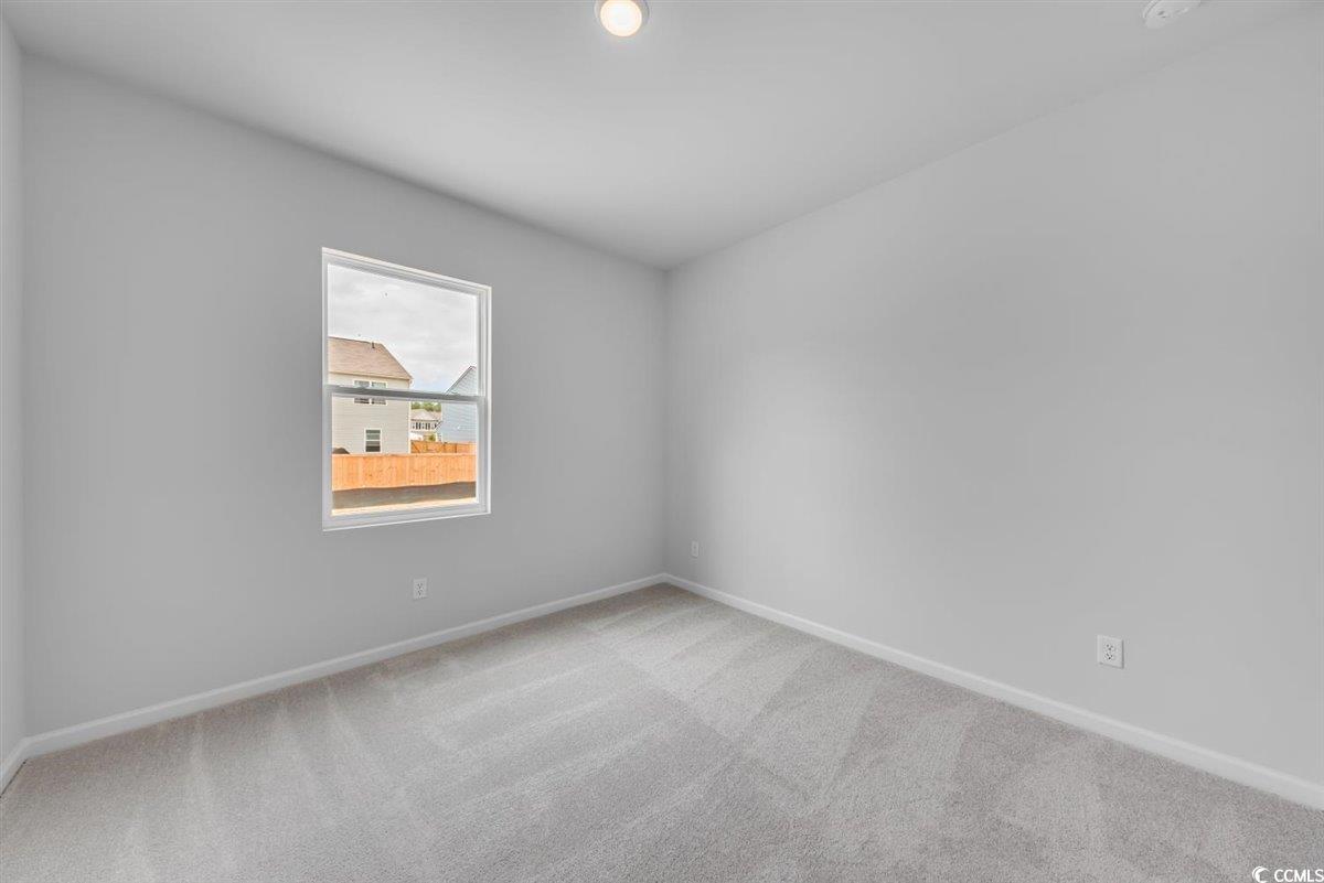 997 Laconic Drive Myrtle Beach, SC 29588 - Photo 16 of 22 Carpeted empty room with baseboards