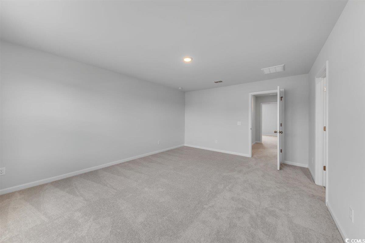 997 Laconic Drive Myrtle Beach, SC 29588 - Photo 19 of 22 Empty room featuring baseboards, visible vents, an