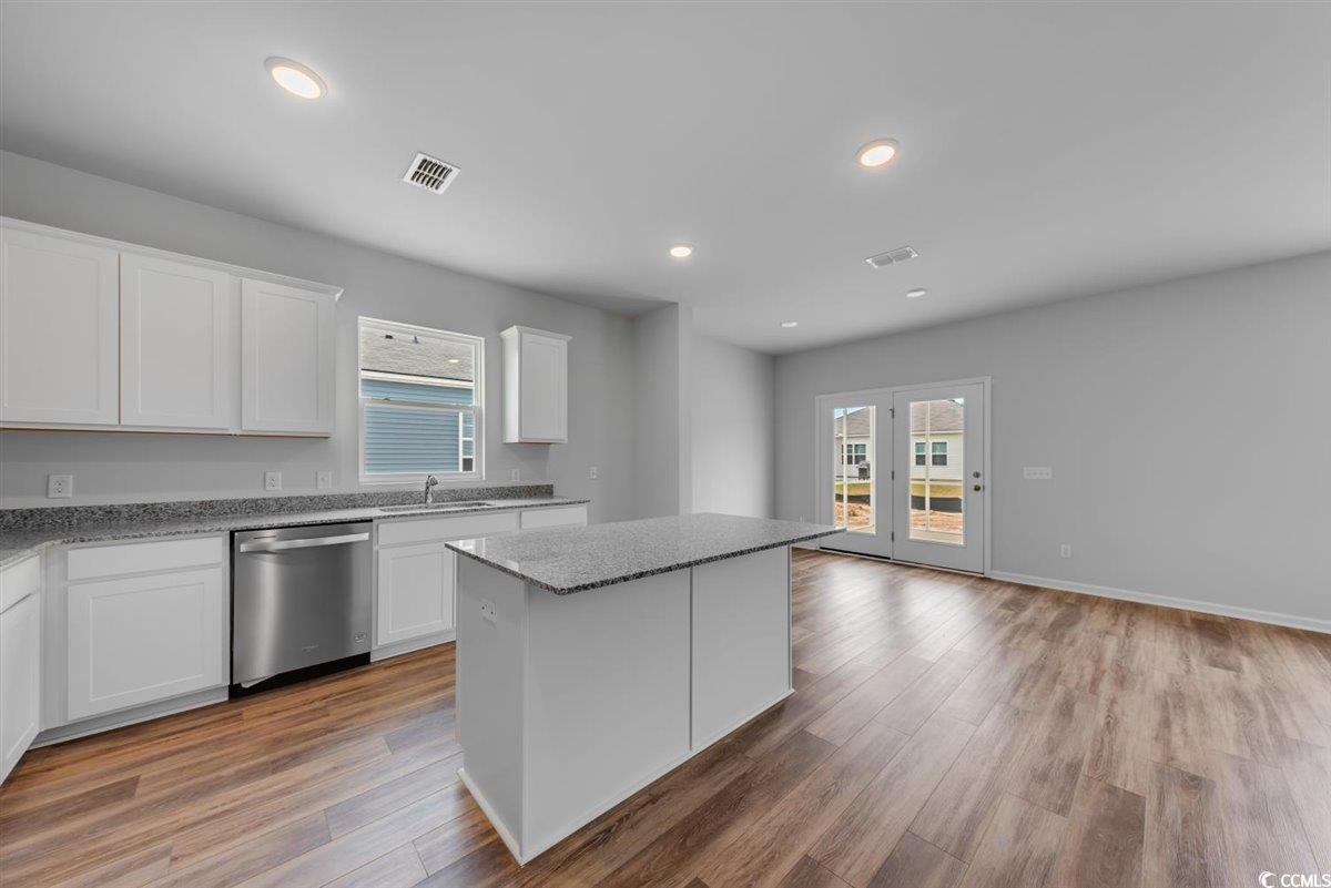 997 Laconic Drive Myrtle Beach, SC 29588 - Photo 5 of 22 Kitchen featuring white cabinetry, visible vents,