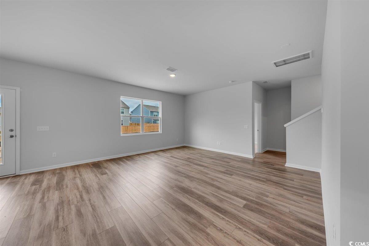 997 Laconic Drive Myrtle Beach, SC 29588 - Photo 6 of 22 Spare room featuring baseboards, visible vents, an