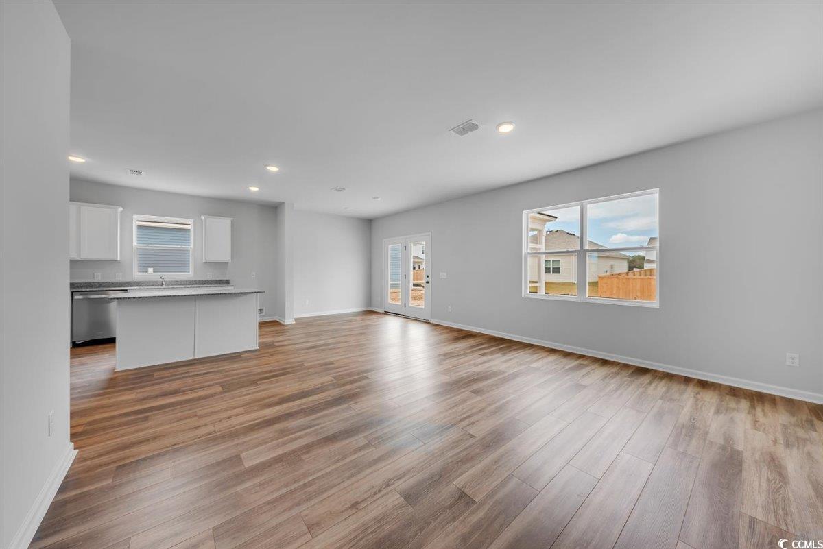 997 Laconic Drive Myrtle Beach, SC 29588 - Photo 7 of 22 Unfurnished living room featuring visible vents, a
