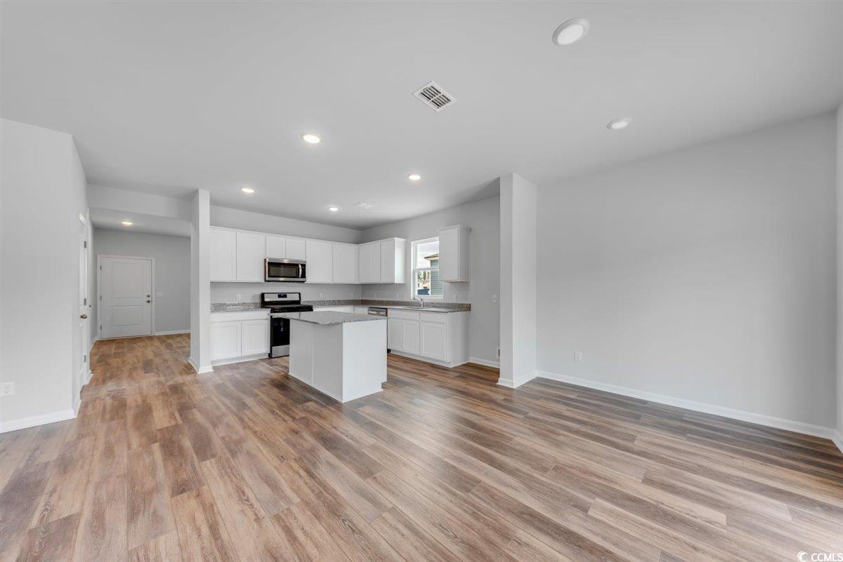997 Laconic Drive Myrtle Beach, SC 29588 - Photo 8 of 22 Kitchen featuring a kitchen island, appliances wit