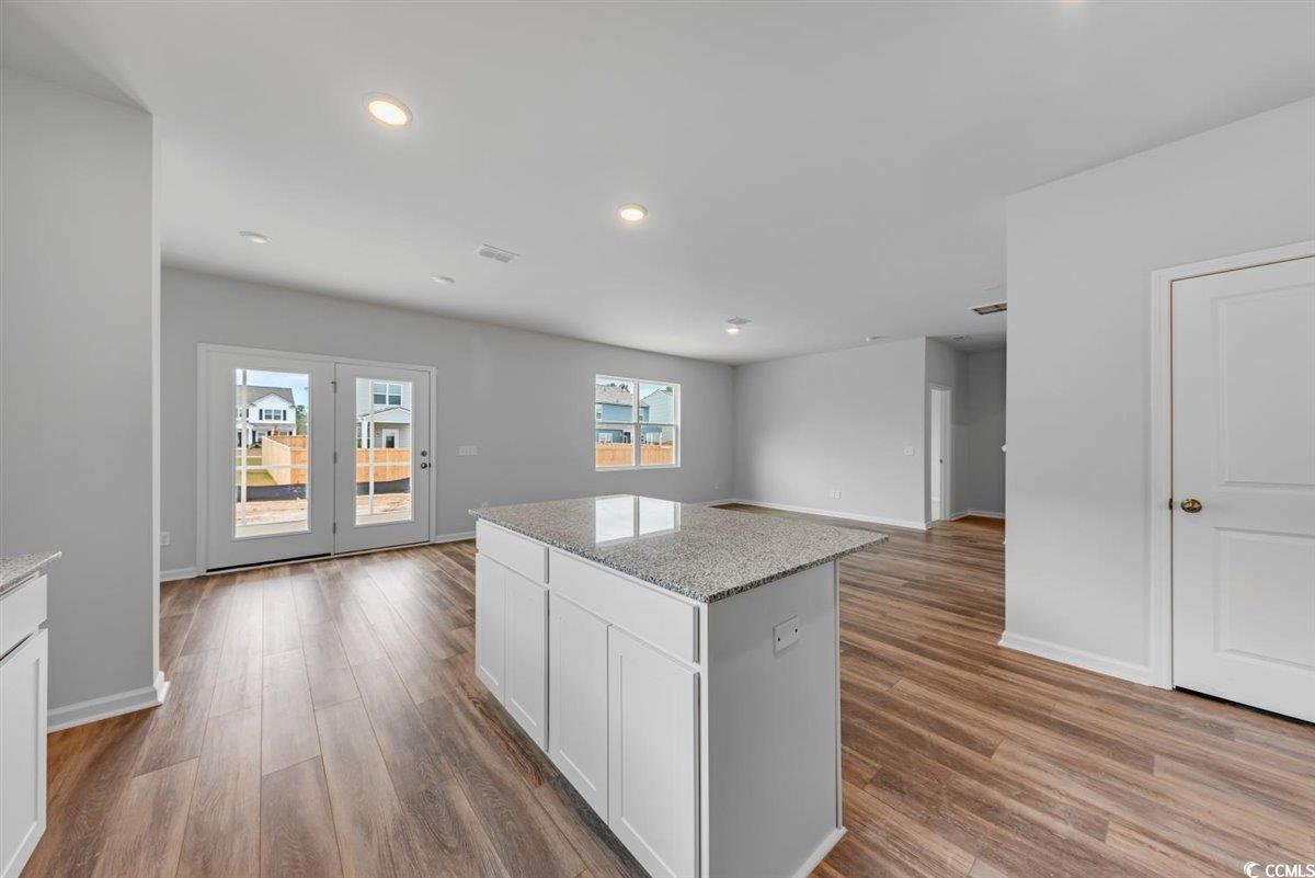 997 Laconic Drive Myrtle Beach, SC 29588 - Photo 10 of 22 Kitchen featuring baseboards, white cabinets, wood