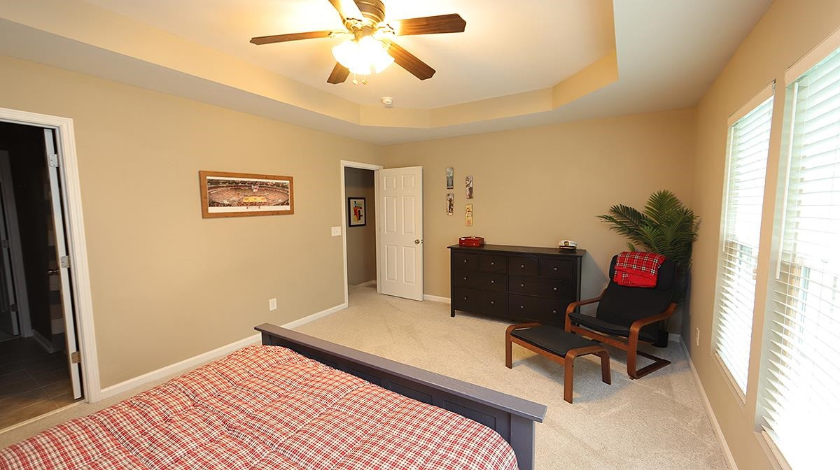 7020 Racine Way Raleigh, NC 27690 - Photo 14 of 26 Nice size Primary Bedroom in back of home with tray ceiling. Primary Bedroom